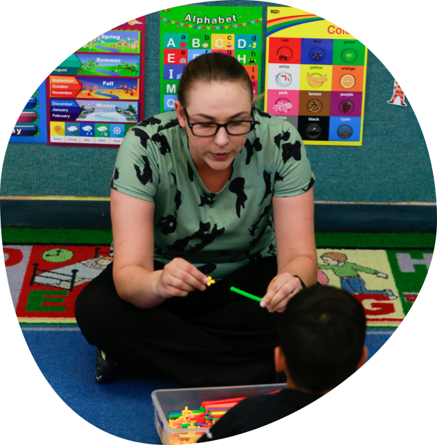 Teacher playing with kids